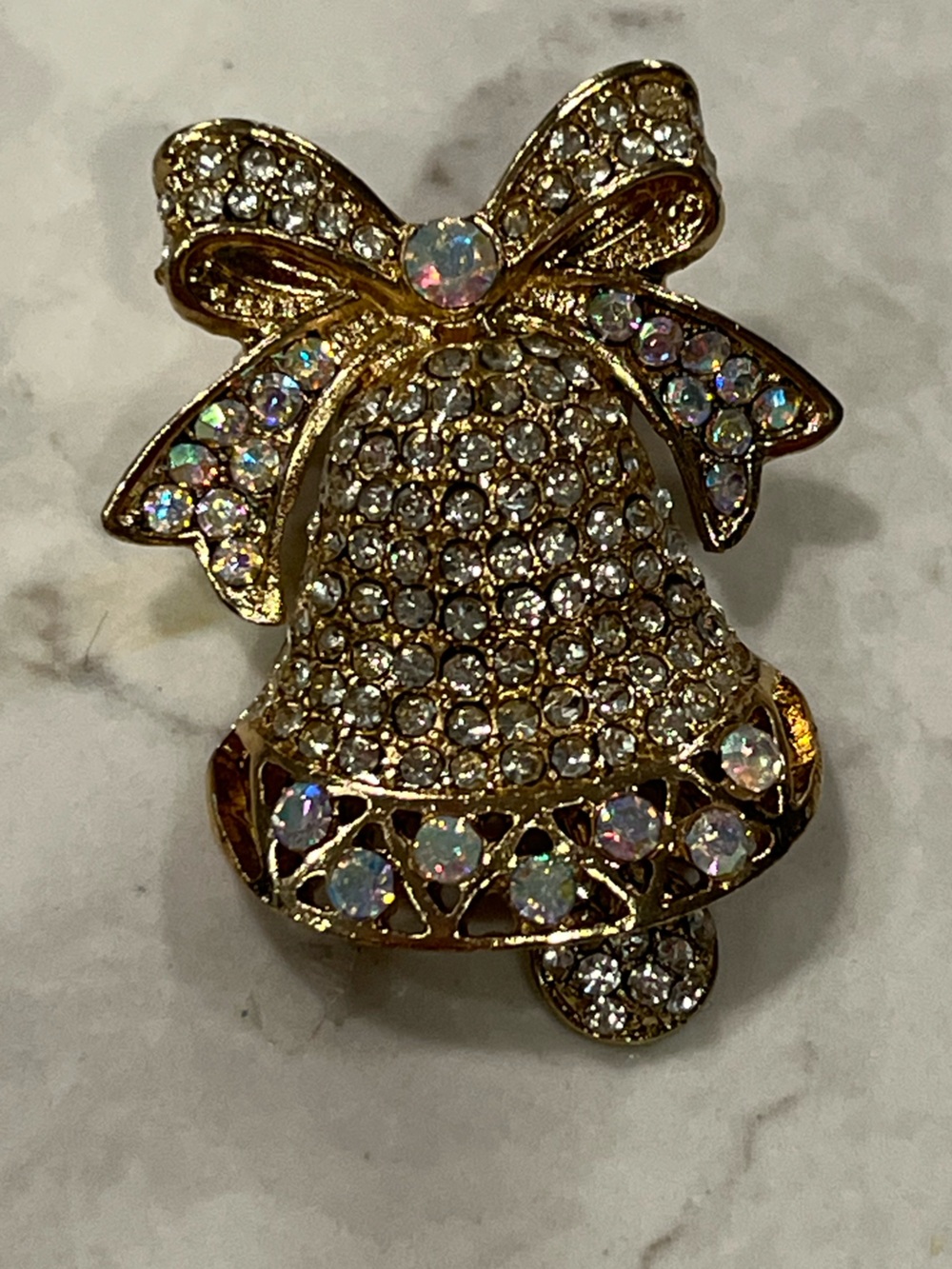 Vintage Gold-Tone bell brooch with moving ball at bottom